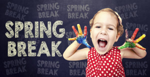 Kid with fingerpaint on hands announcing Spring Break